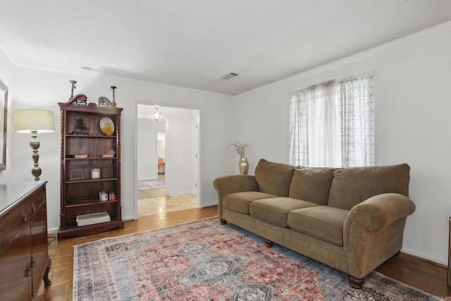 living area featuring ornamental molding and baseboards