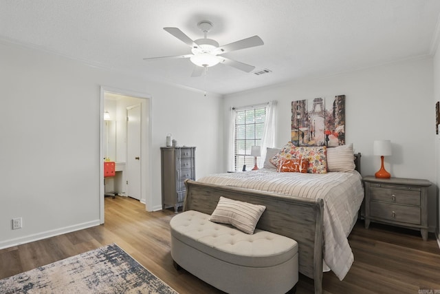 bedroom with wood finished floors, crown molding, ceiling fan, and baseboards