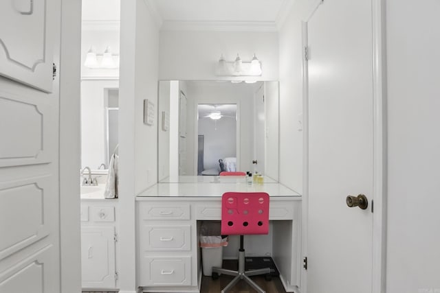 bathroom featuring ornamental molding and vanity