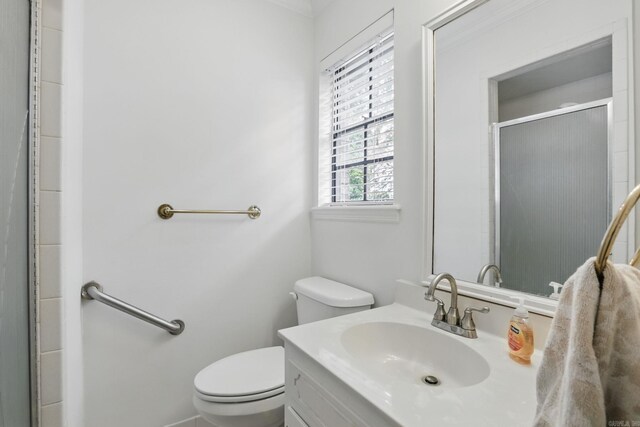 full bathroom with a shower stall, toilet, and vanity