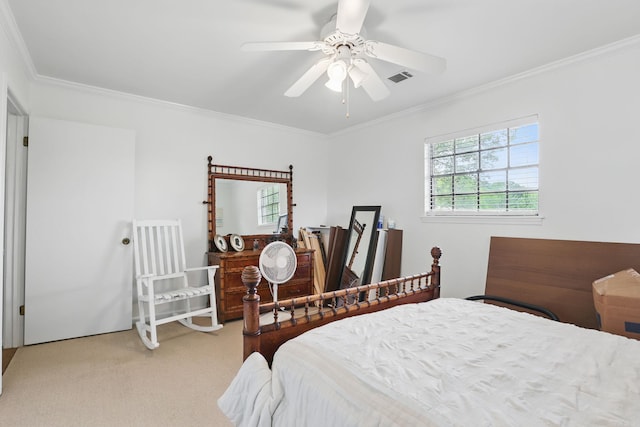 carpeted bedroom featuring ornamental molding and a ceiling fan