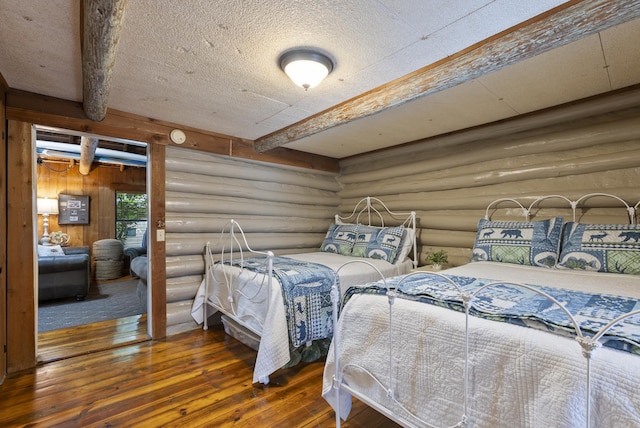 112 Fairchild Pt, Hot Springs, AR 71901 - bedroom featuring log walls, hardwood / wood-style flooring, and beam ceiling