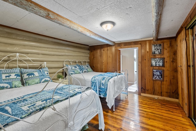 112 Fairchild Pt, Hot Springs, AR 71901 - bedroom with wood-type flooring and beamed ceiling