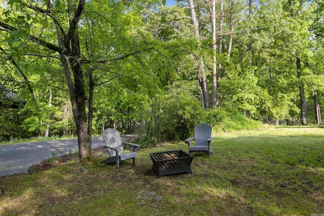 112 Fairchild Pt, Hot Springs, AR 71901 - view of yard featuring an outdoor fire pit and a wooded view