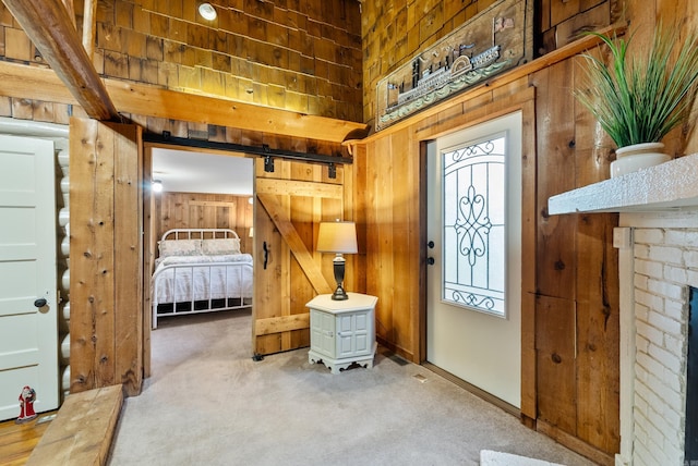 112 Fairchild Pt, Hot Springs, AR 71901 - entrance foyer with wooden walls, carpet flooring, and a barn door