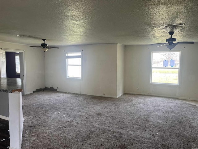 475 S 2nd St, Tillar, AR 71670 - spare room featuring a ceiling fan, a textured ceiling, carpet, and baseboards