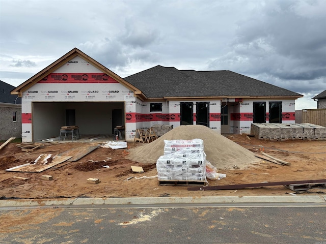21057 Kinsley Ln, Hensley, AR 72065 - property under construction with an attached garage and roof with shingles