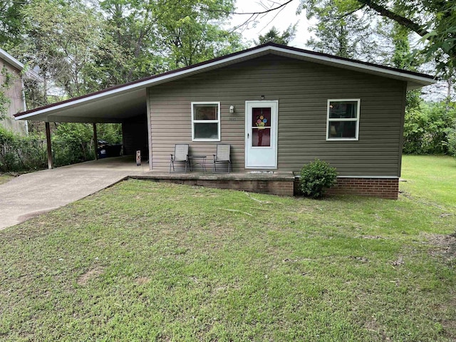 3605 W Overland Cir, Harrison, AR 72601 - view of front of house featuring concrete driveway, a front lawn, and a carport