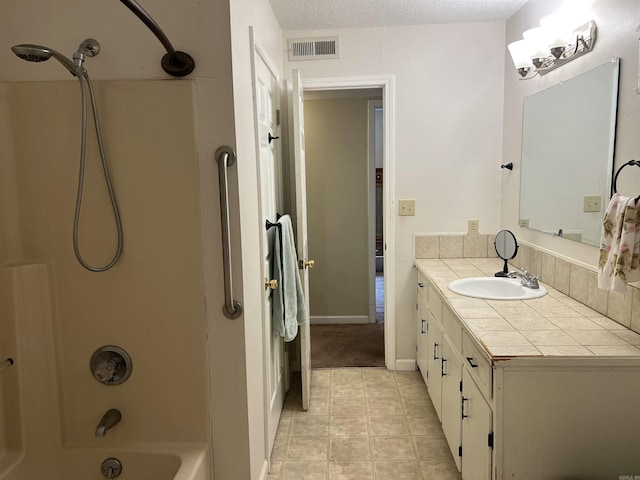 3605 W Overland Cir, Harrison, AR 72601 - full bathroom with vanity, shower / washtub combination, a textured ceiling, and tile patterned flooring