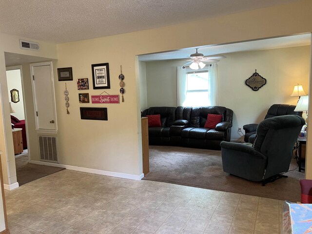 3605 W Overland Cir, Harrison, AR 72601 - living room featuring a ceiling fan, a textured ceiling, and light colored carpet
