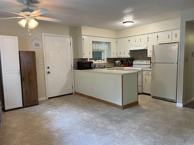 3605 W Overland Cir, Harrison, AR 72601 - kitchen featuring white appliances, under cabinet range hood, a textured ceiling, a peninsula, and a ceiling fan