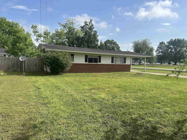 907 E 9th, Russellville, AR 72801 - view of front facade featuring brick siding and a carport