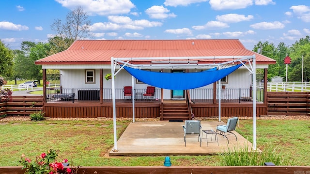 271 Austin Loop, El Paso, AR 72045 - back of house with a patio area, a wooden deck, and metal roof