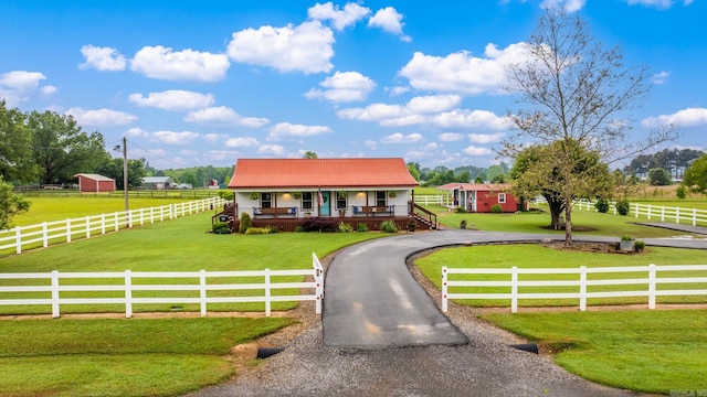 271 Austin Loop, El Paso, AR 72045 - view of front of property featuring a porch, driveway, a rural view, and metal roof