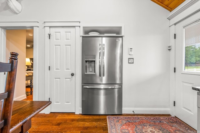 271 Austin Loop, El Paso, AR 72045 - kitchen with stainless steel fridge with ice dispenser, dark wood finished floors, baseboards, and vaulted ceiling