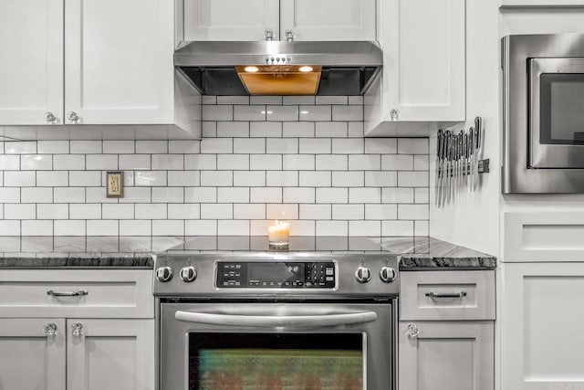 271 Austin Loop, El Paso, AR 72045 - kitchen featuring appliances with stainless steel finishes, under cabinet range hood, white cabinets, dark stone counters, and decorative backsplash
