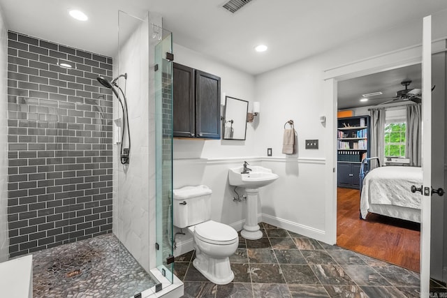 271 Austin Loop, El Paso, AR 72045 - full bathroom featuring a shower stall, a ceiling fan, recessed lighting, toilet, and baseboards