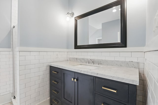 320 W 18th St, Little Rock, AR 72206 - bathroom with tile walls, vanity, and a wainscoted wall