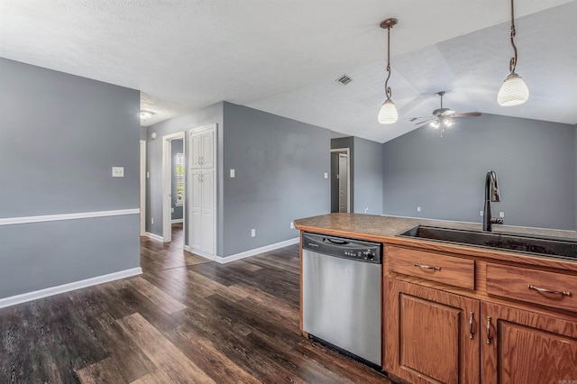 kitchen featuring dishwasher, a sink, a ceiling fan, dark wood finished floors, and baseboards