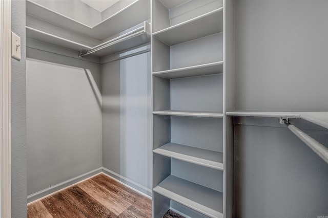 spacious closet with wood finished floors