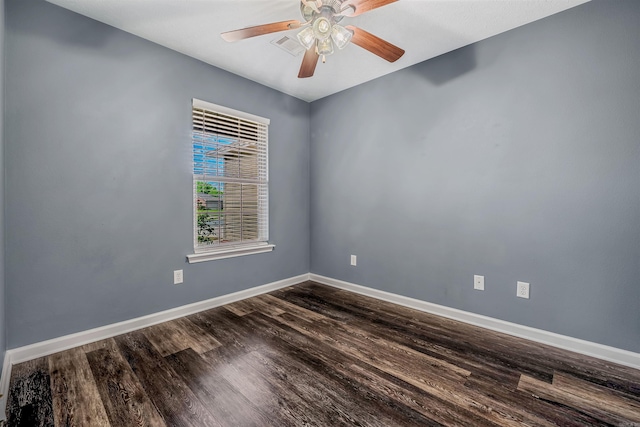 unfurnished room with dark wood finished floors, baseboards, and ceiling fan