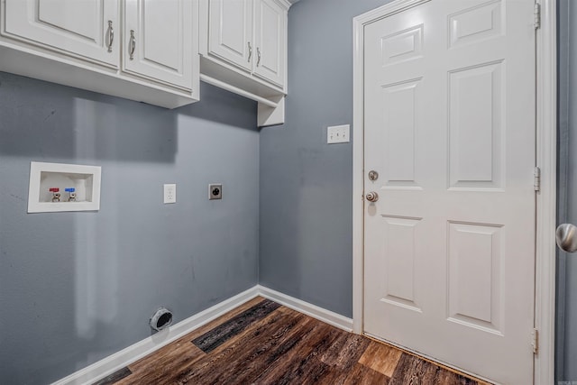 laundry area with hookup for an electric dryer, dark wood finished floors, cabinet space, washer hookup, and baseboards