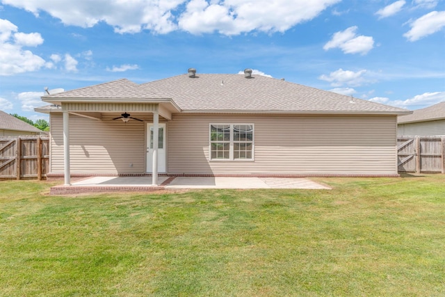 back of property with ceiling fan, a patio area, roof with shingles, and a gate