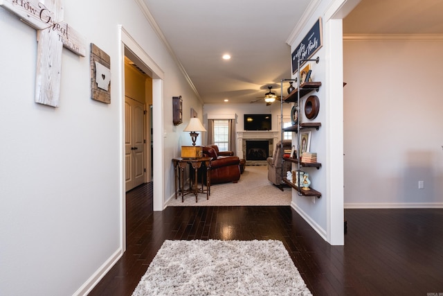 hall featuring ornamental molding, baseboards, recessed lighting, and hardwood / wood-style flooring