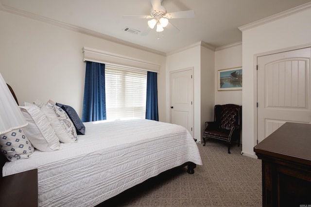 carpeted bedroom with ornamental molding and ceiling fan