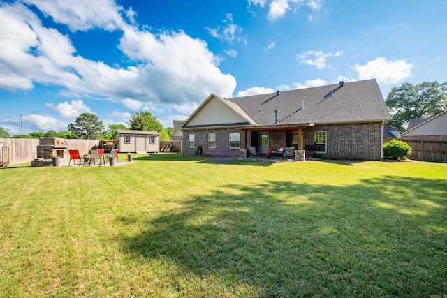 back of house featuring a patio area, a storage shed, an outdoor structure, and brick siding