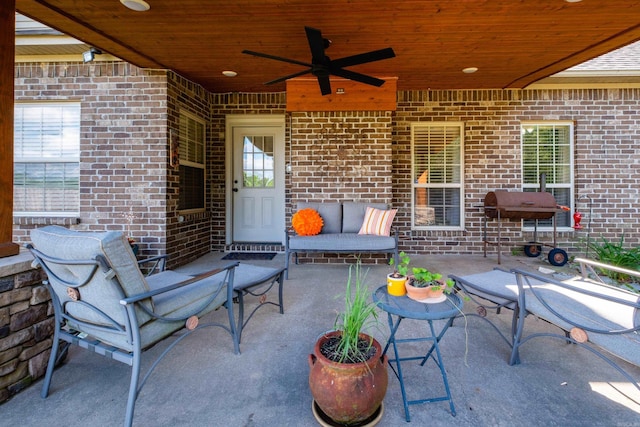 view of patio with a ceiling fan and an outdoor living space