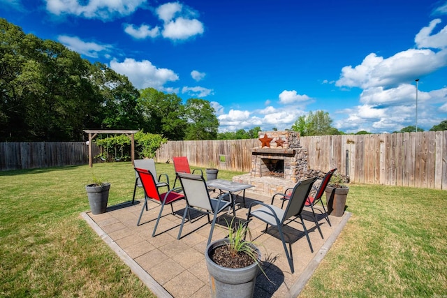 view of patio / terrace with an outdoor stone fireplace