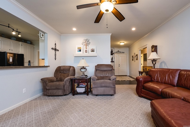 living area featuring crown molding, baseboards, ceiling fan, recessed lighting, and light colored carpet