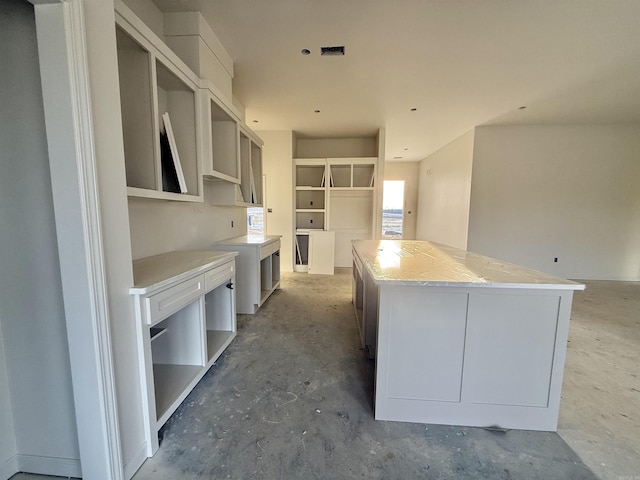 238 Kelton St, Hensley, AR 72065 - kitchen with a center island and concrete flooring