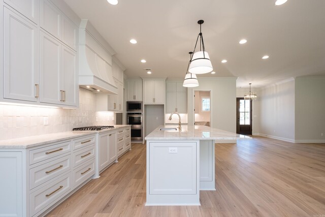 20 Abington Ct, Little Rock, AR 72223 - kitchen featuring stainless steel appliances, a sink, backsplash, white cabinetry, and crown molding