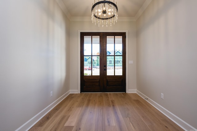 20 Abington Ct, Little Rock, AR 72223 - entryway featuring french doors, a chandelier, wood finished floors, baseboards, and ornamental molding