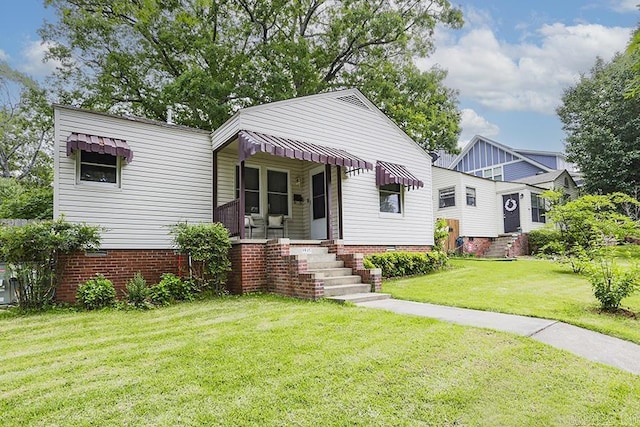 view of front of home with a front lawn, covered porch, and crawl space