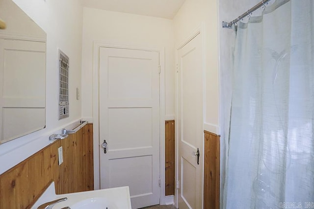 bathroom with a sink and a shower with curtain