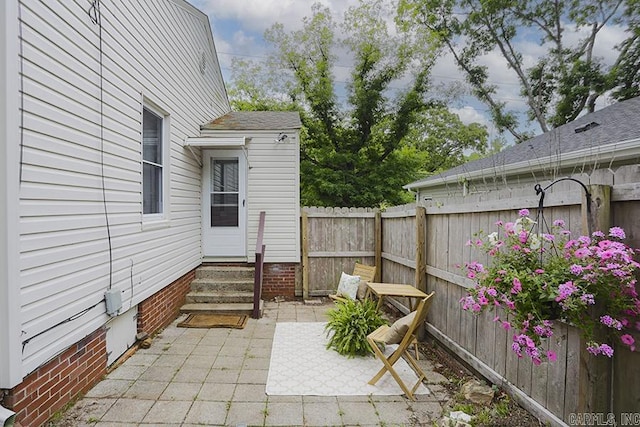 view of patio featuring entry steps and a fenced backyard