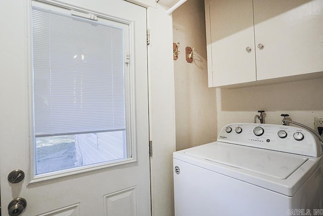 washroom with washer / clothes dryer and cabinet space