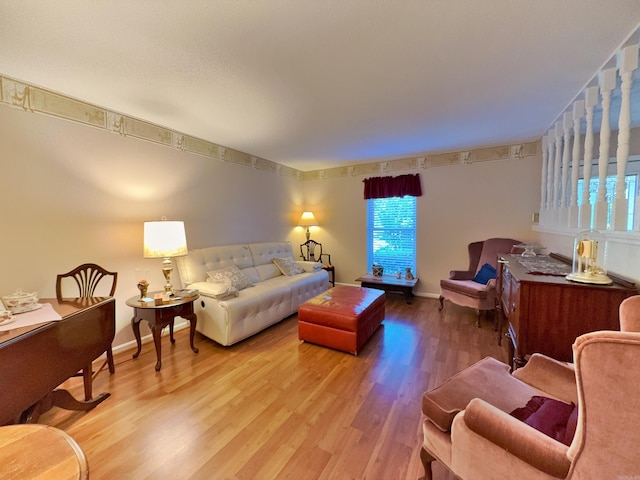 living room with wood finished floors and baseboards