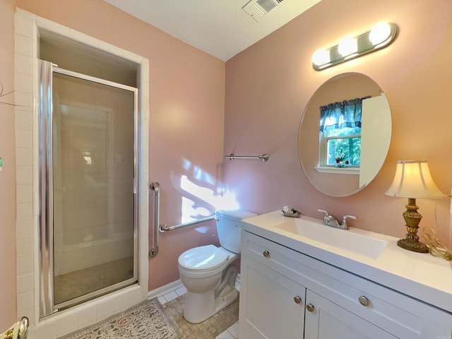 full bathroom with toilet, a shower stall, tile patterned flooring, and vanity