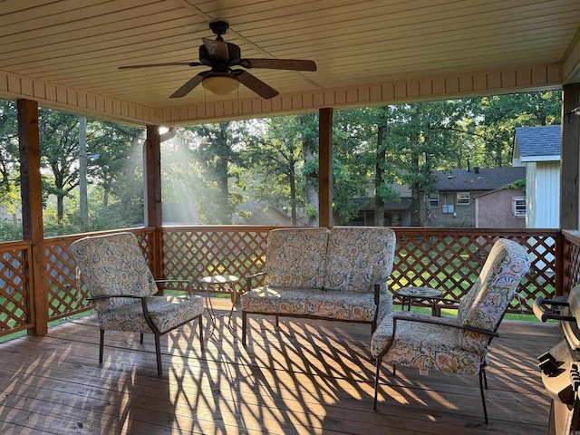 wooden deck featuring a ceiling fan and outdoor lounge area