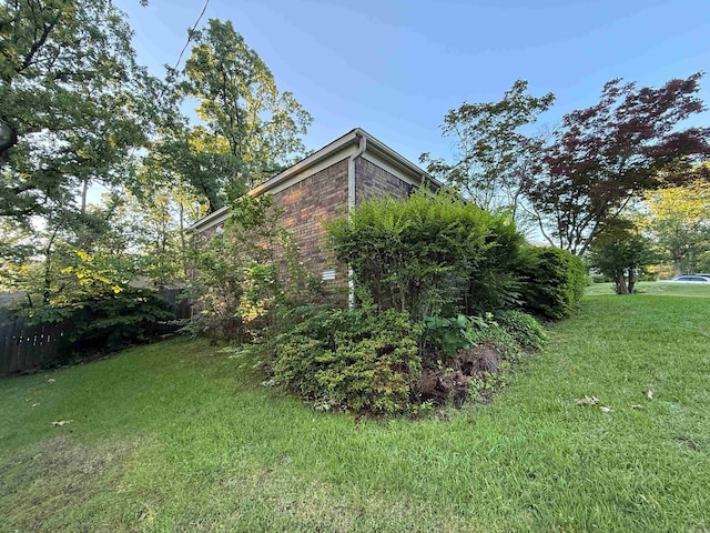 view of property exterior featuring brick siding