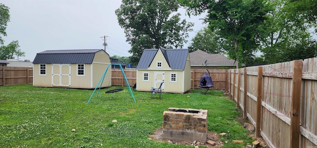 view of yard with a shed and an outbuilding