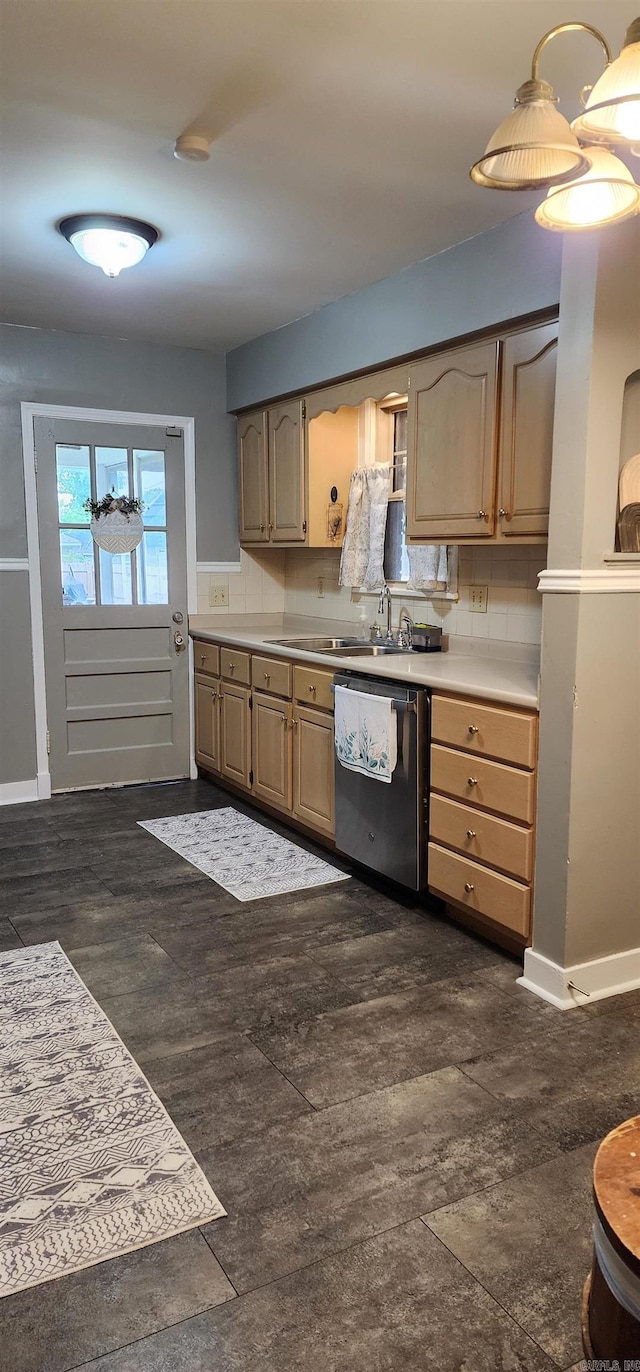 kitchen featuring stainless steel dishwasher, light countertops, a sink, dark wood-style flooring, and light brown cabinets