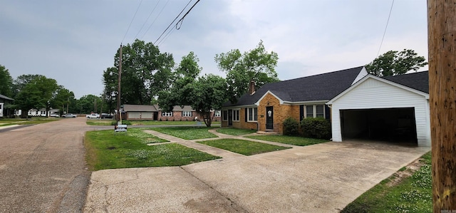 view of front facade with an attached garage, concrete driveway, a front yard, brick siding, and a chimney