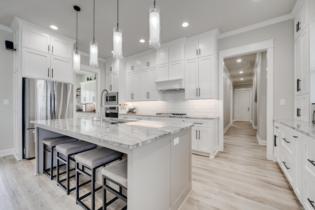 kitchen featuring stainless steel appliances, tasteful backsplash, recessed lighting, light wood-style flooring, and crown molding