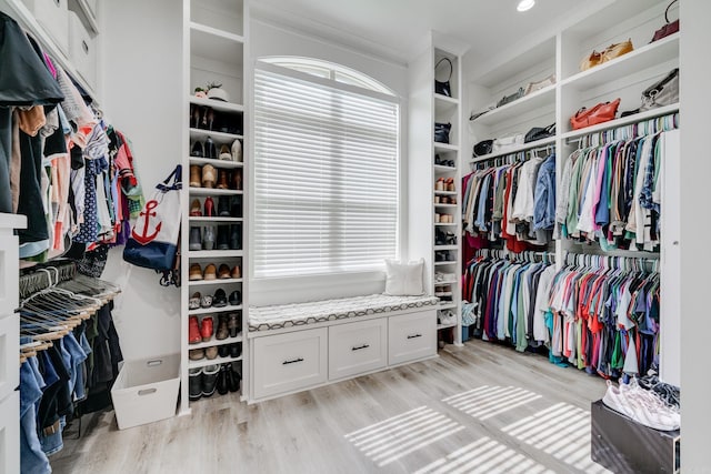 spacious closet featuring light wood finished floors