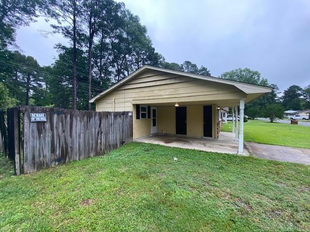 3804 Arapaho Trl, Little Rock, AR 72209 - view of front facade featuring a patio area and a carport